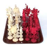 A 19th century Chinese carved ivory chess set, each of the 32 pieces intricately carved as figures