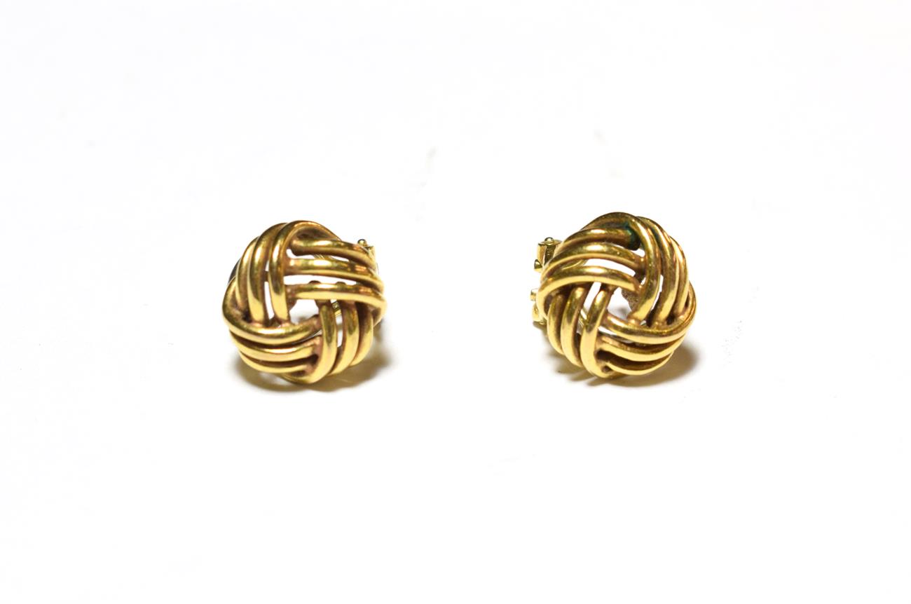 A pair of 9 carat gold knot earrings, with post and clip fittings . Gross weight 6.7 grams.