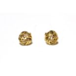 A pair of 9 carat gold knot earrings, with post and clip fittings . Gross weight 6.7 grams.