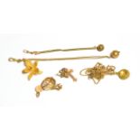 A collection of miscellaneous jewellery including a filigree flower brooch (pin stamped '750'),