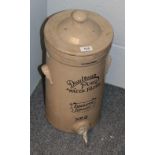 A Doulton Lambeth Stoneware Puro water filter, with cover and tap fitting