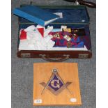 A leather case, containing Masonic regalia, together with a Masonic tile