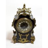 A French ebonised and gilt metal mounted timepiece signed Fargot B.T Paris