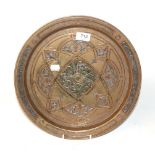 A Middle Eastern copper, brass and silver inlaid charger, 19th century