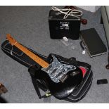 A Fender amp; a Manhattan electric guitar; and an oboe in soft case