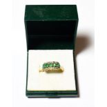 A 9 carat gold emerald and diamond cluster ring, finger size Q. Gross weight 3.5 grams.