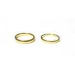 An 18 carat gold band ring, finger size M; and another band ring, marks rubbed, finger size L. 18