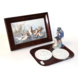 A Royal Copenhagen figure of a boy number 905, two Royal Copenhagen plaques and a Spanish