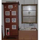 A tall slender dolls' house together with doll house furniture and accessories and a small glazed