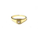 An 18 carat gold diamond solitaire ring, finger size S. Gross weight 3.7 grams.