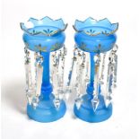 A pair of Victorian blue glass table lustres