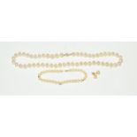 A cultured pearl necklace, length 47cm; a cultured pearl bracelet, length 20.5cm; and a pair of