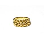 An 18 carat gold rope ring, finger size P. Gross weight 8.7 grams.