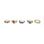 An 18 carat gold diamond half hoop ring, finger size L1/2; a sapphire and diamond five stone ring,
