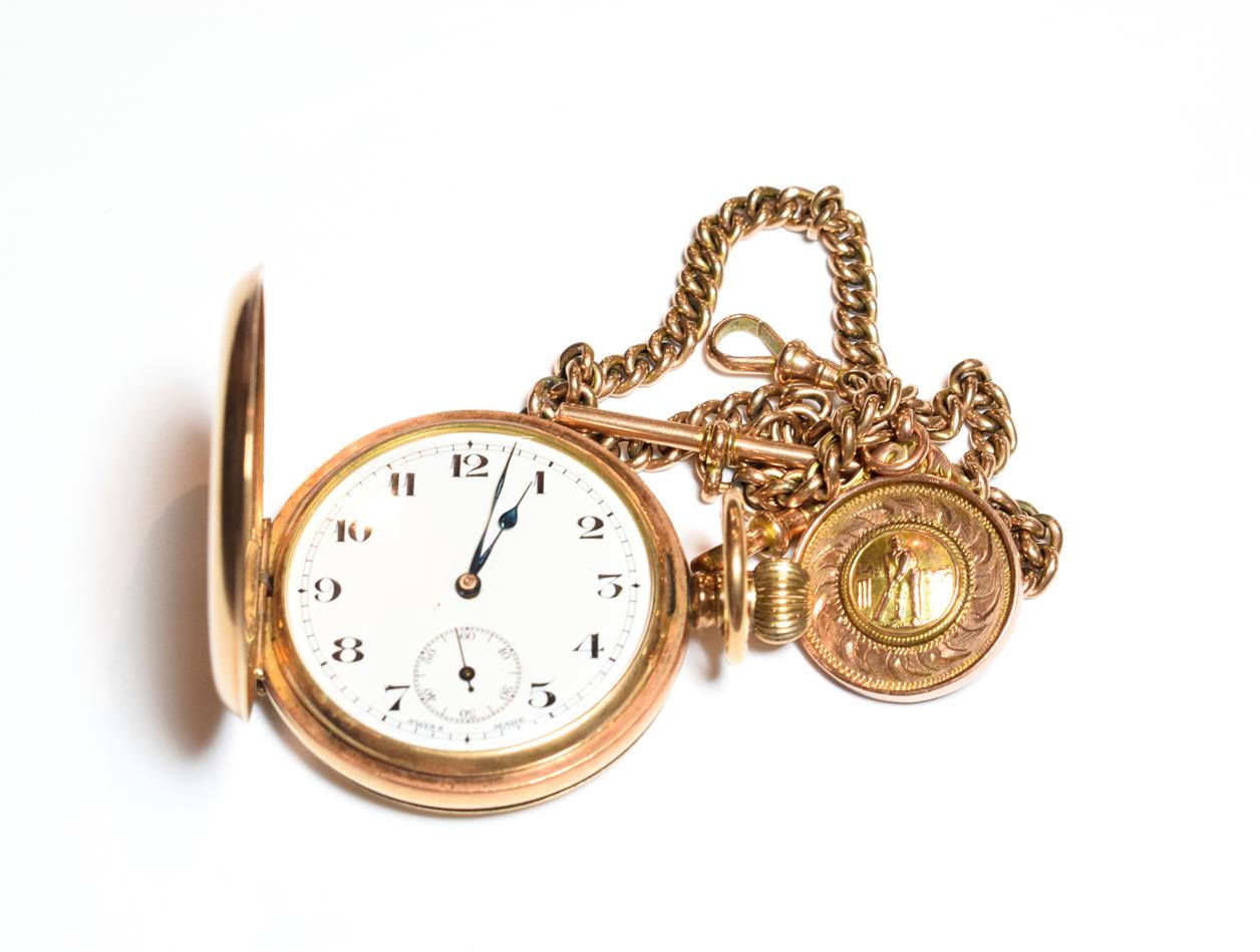 A gold plated full hunter pocket watch, with an attached curb link watch chain with each link