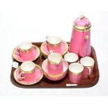 A Royal Worcester pink and gilt highlighted coffee service