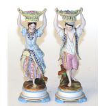 A pair of Victorian bisque figures of flower sellers