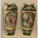 A pair of Vienna porcelain vases, hand painted with floral designs and vignettes with figures