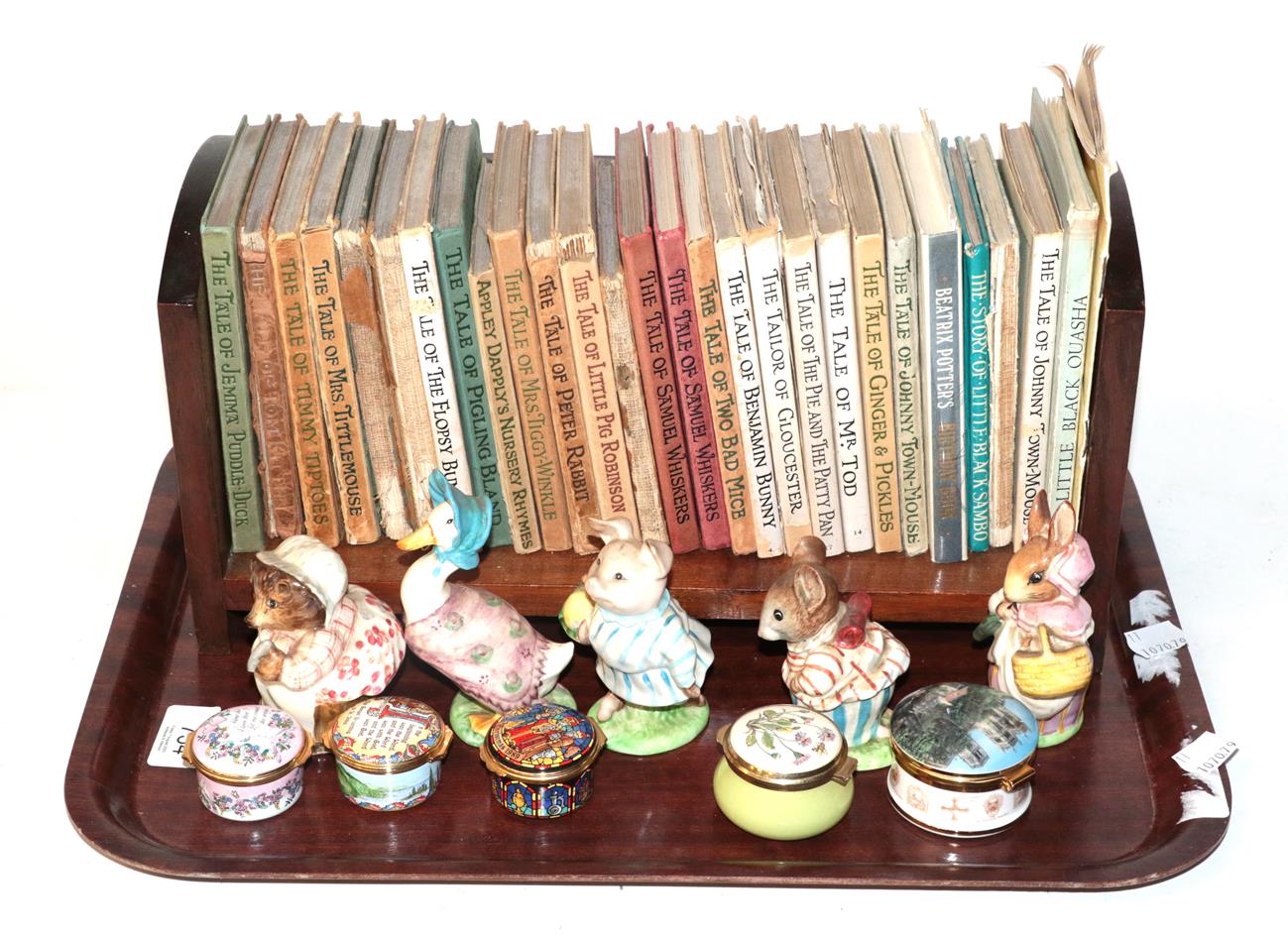 A group of Beatrix Potter books, five Beswick Beatrix Potter models, three Halcyon Days enamel boxes