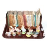 A group of Beatrix Potter books, five Beswick Beatrix Potter models, three Halcyon Days enamel boxes