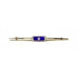 A diamond and lapis lazuli bar brooch, stamped '15CT' and 'PLAT', length 7.3cm . Gross weight 4.4