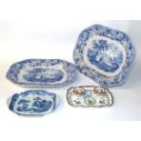 A pair of 19th century pearl ware blue and white dishes decorated with figures and a country