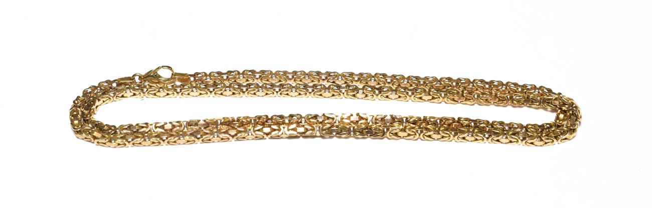 A byzantine link necklace, stamped '375', length 62cm . Gross weight 30.9 grams.
