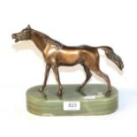 A bronze horse with green onyx base