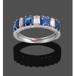 A Sapphire and Diamond Seven Stone Ring, four step cut sapphires alternate with three baguette cut