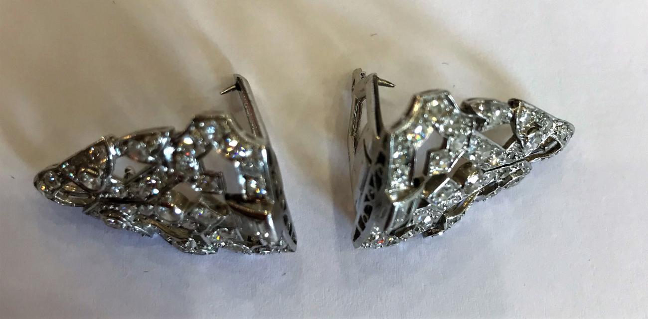 An Art Deco Diamond Double Clip Brooch, the geometric form inset with baguette cut, old cut and - Image 3 of 3