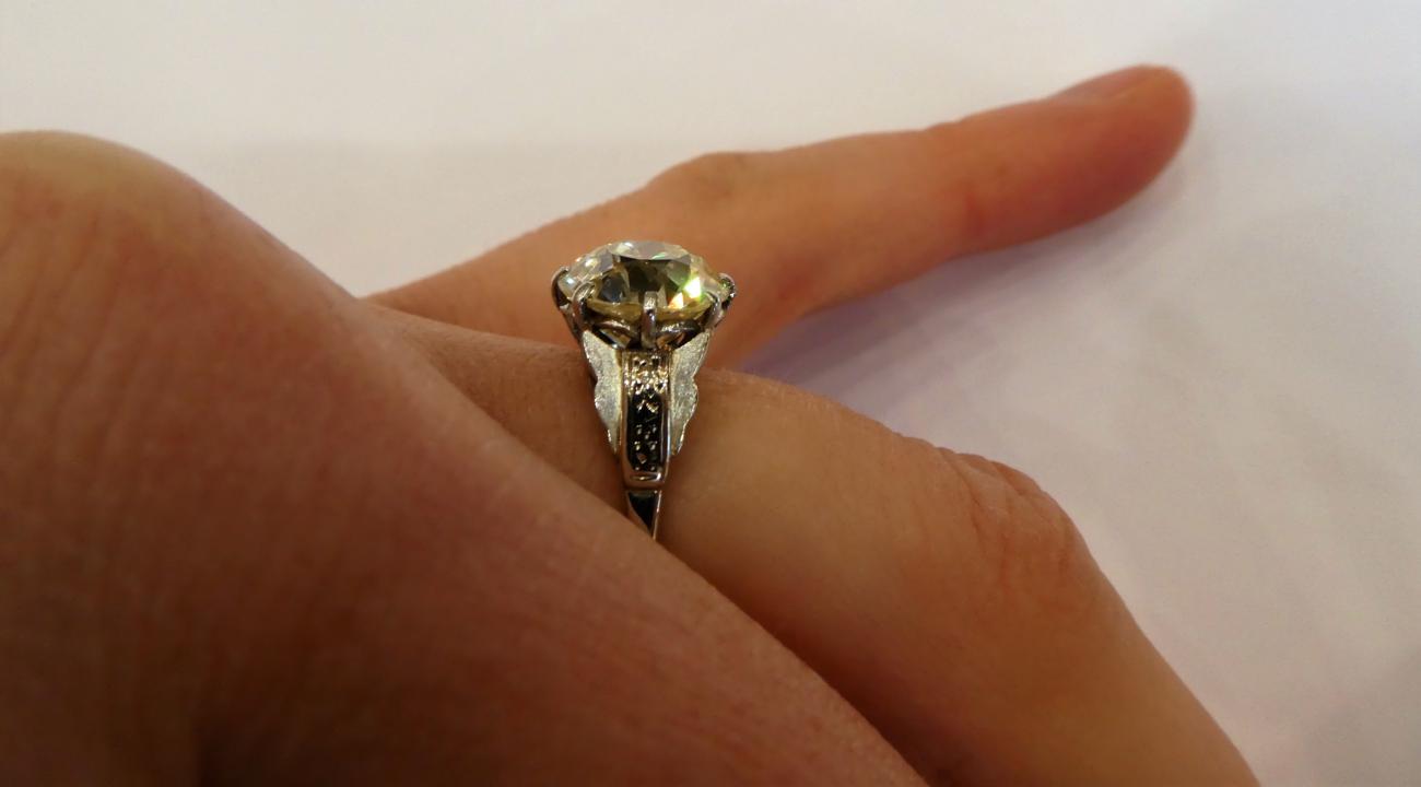 A Diamond Solitaire Ring, the old cut diamond in a white claw setting, to fancy panelled shoulders - Image 6 of 7
