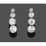 A Pair of Diamond Drop Earrings, four graduated old cut diamonds in white millegrain settings, total