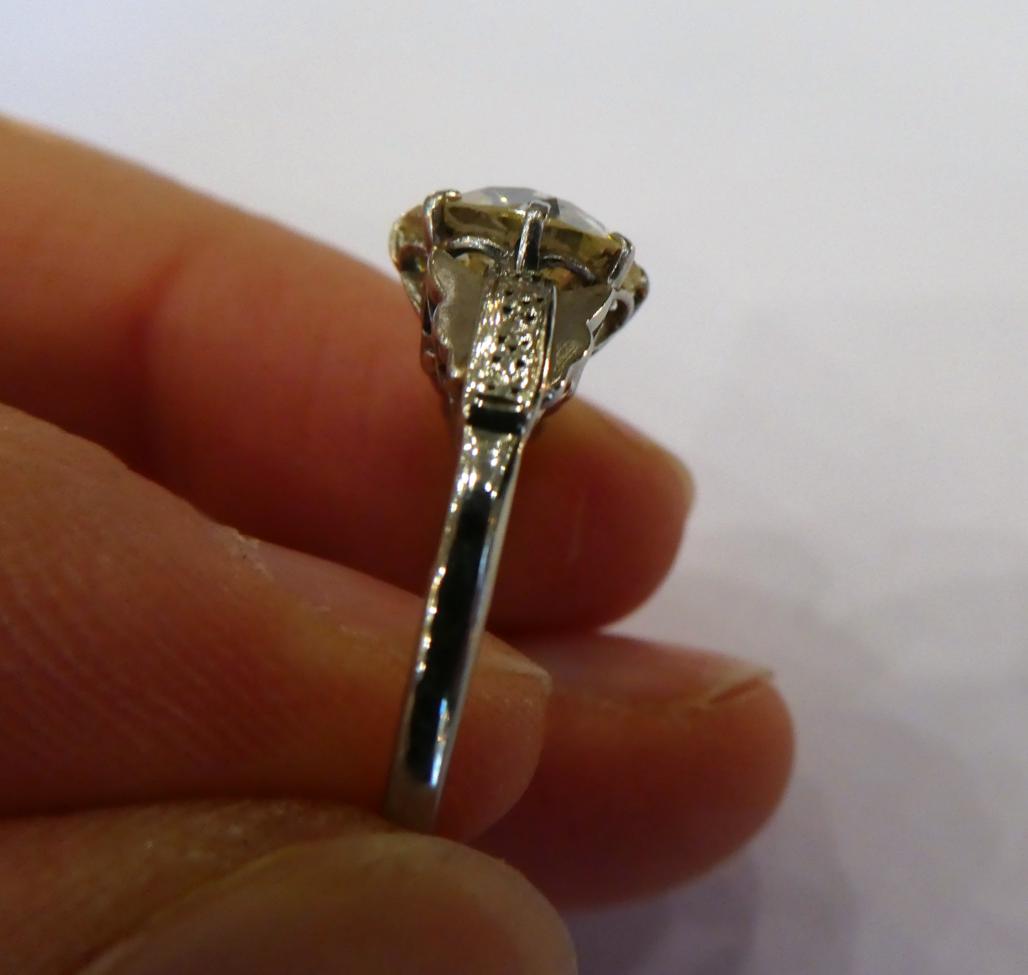 A Diamond Solitaire Ring, the old cut diamond in a white claw setting, to fancy panelled shoulders - Image 4 of 7