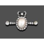 A Mabe Pearl and Diamond Brooch, a bow motif set throughout with old cut diamonds surmounts a mabe