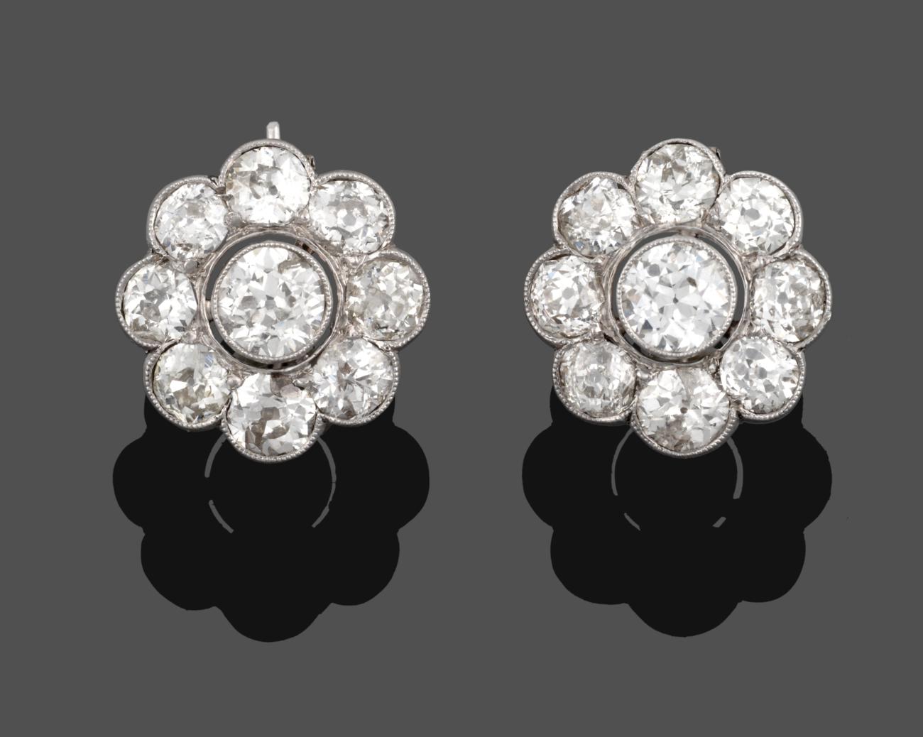 A Pair of Diamond Cluster Earrings, an old cut diamond within a border of eight smaller old cut