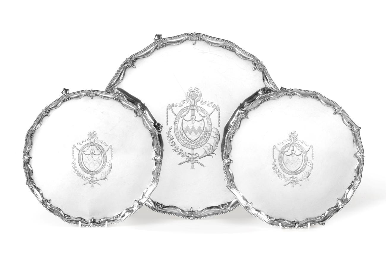 A Set of Three George III Silver Salvers, by Richard Rugg, London, 1776, each shaped circular and on