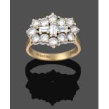 An 18 Carat Gold Diamond Cluster Ring, three baguette cut diamonds set centrally within a border