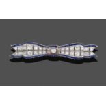 An Art Deco Diamond and Sapphire Bow Brooch, two rows of graduated diamonds bordered by calibré