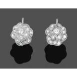 A Pair of Diamond Cluster Earrings, the floral motifs set with brilliant cut and eight-cut