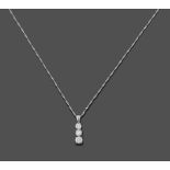 An 18 Carat White Gold Diamond Pendant on A Platinum Chain, a trio drop of round brilliant cut