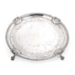 A George III Scottish Silver Salver, by P. Cunningham and Son, Edinburgh, 1810, circular and on four