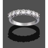 A Diamond Seven Stone Ring, by Tiffany & Co., the round brilliant cut diamonds in white claw