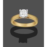 An 18 Carat Gold Diamond Solitaire Ring, the round brilliant cut diamond in a white claw setting, to