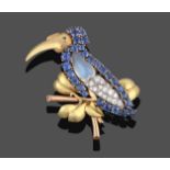 A Bird Brooch, by Cartier, modelled as a bird, possibly a dodo, perched on a branch, its body formed