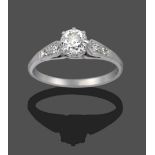 A Diamond Solitaire Ring, the old cut diamond in a white claw setting, to pairs of graduated old cut