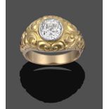 A Diamond Solitaire Ring, the old cut diamond in a yellow millegrain setting to a floral chased