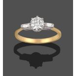 An 18 Carat Gold Diamond Solitaire Ring, the round brilliant cut diamond to shoulders set with a
