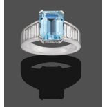 An 18 Carat White Gold Aquamarine and Diamond Ring, the emerald-cut aquamarine in a white four