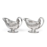 A Pair of George V Silver Sauceboats, by Omar Ramsden, London, 1922, each oval and on spreading foot