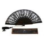 A Late 19th Century Black Chantilly Lace Fan, the leaf mounted on tortoiseshell,